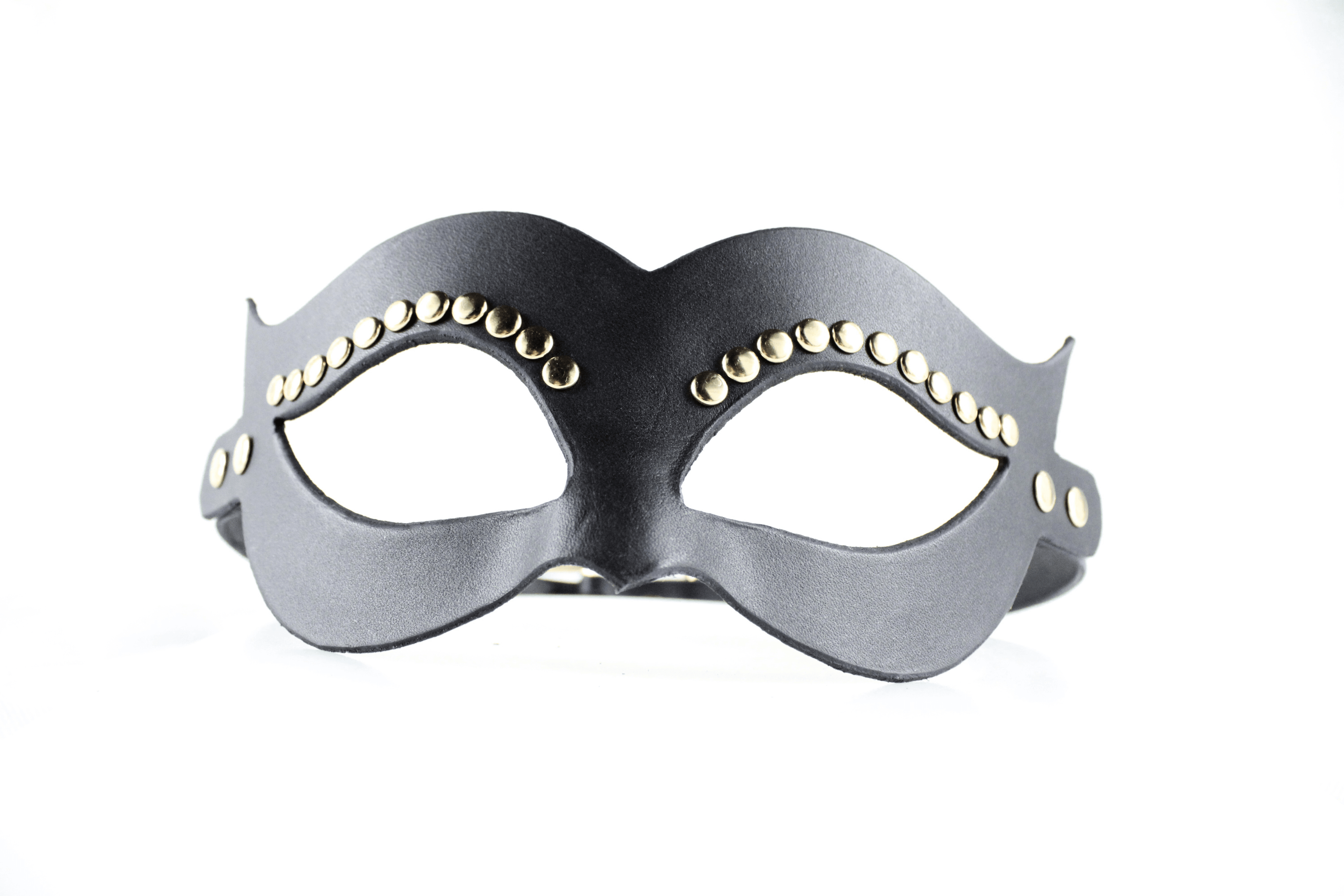 A black leather mask with gold studs on the sides.