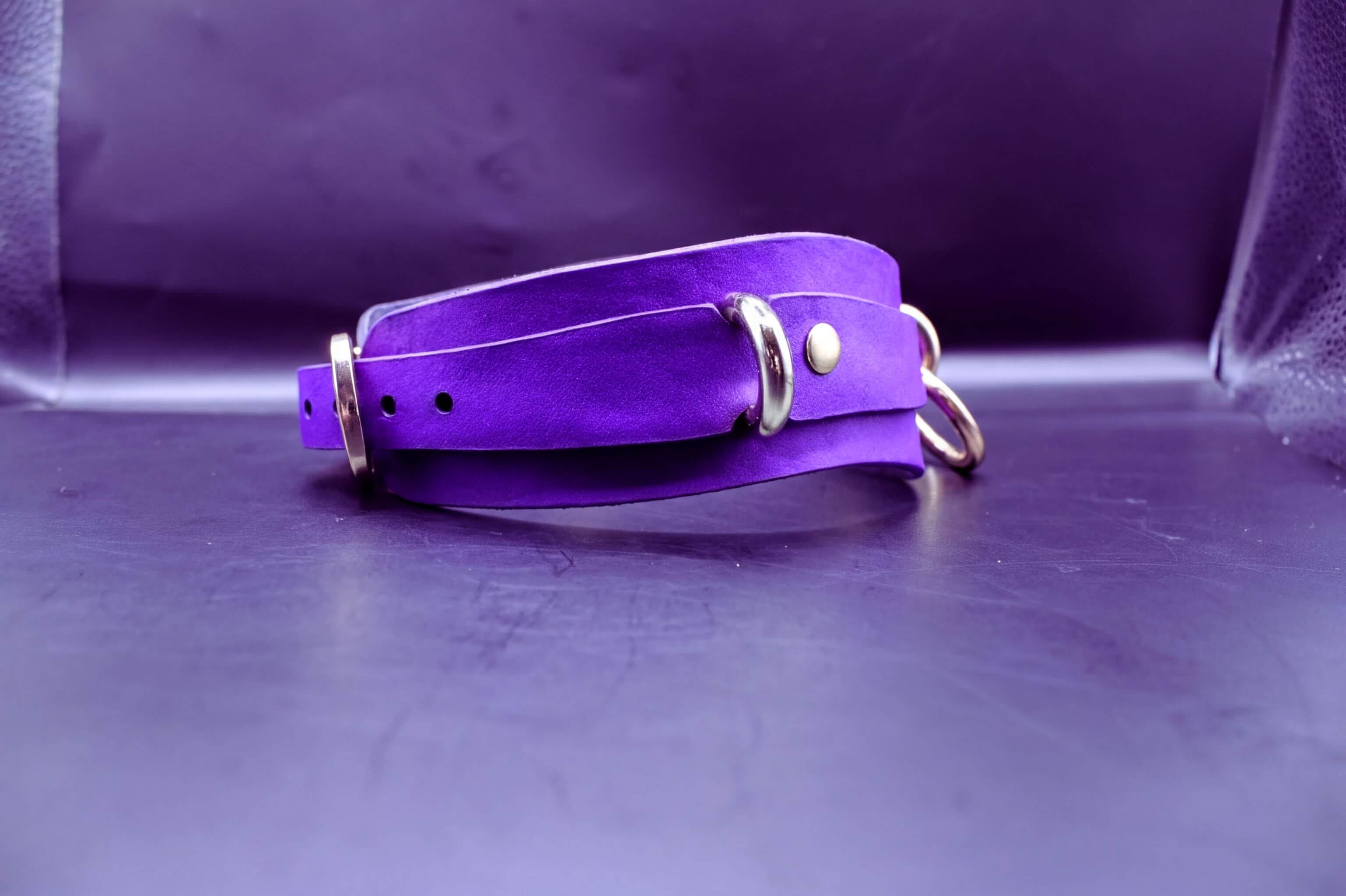 Handcrafted purple posture collar with gold hardware for BDSM, submissive jewelry, and kink lifestyles.
