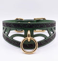 A green leather choker collar with a gold ring and buckle.