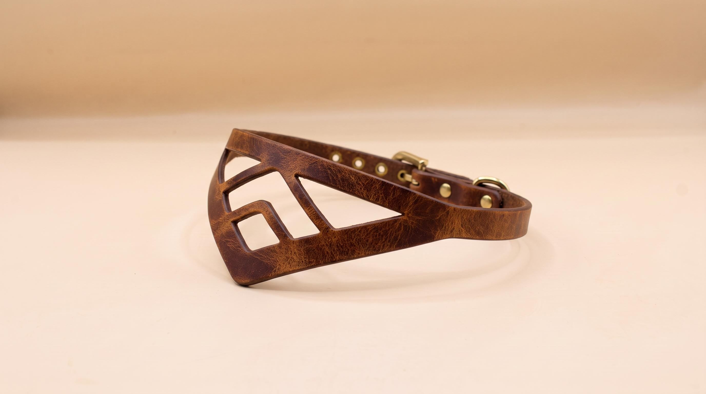 A brown leather collar with a geometric cutout design.