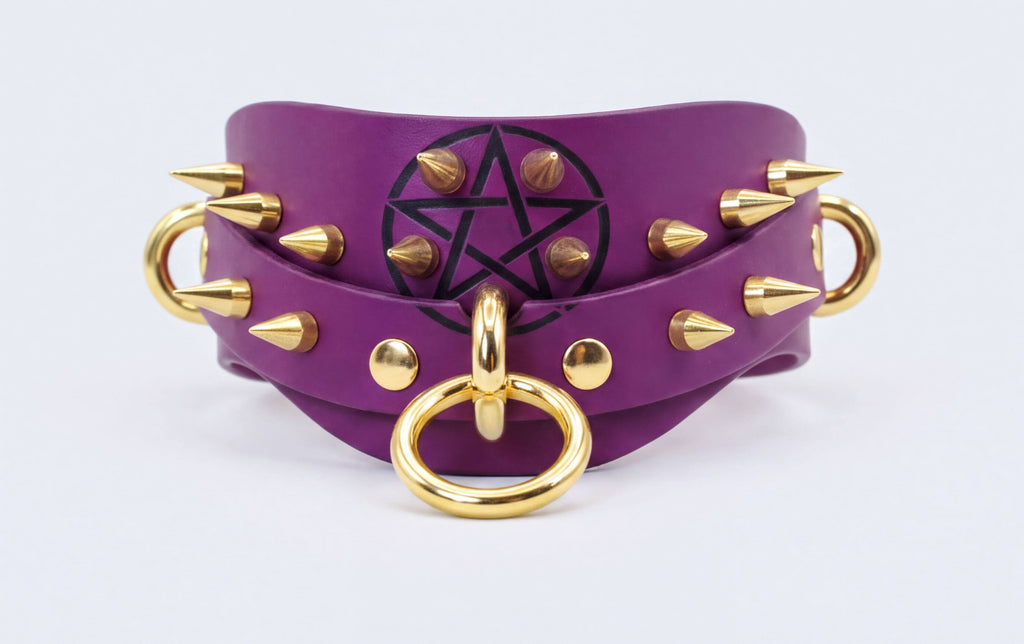 A purple leather choker necklace with gold studs and a black pentagram symbol on the front.