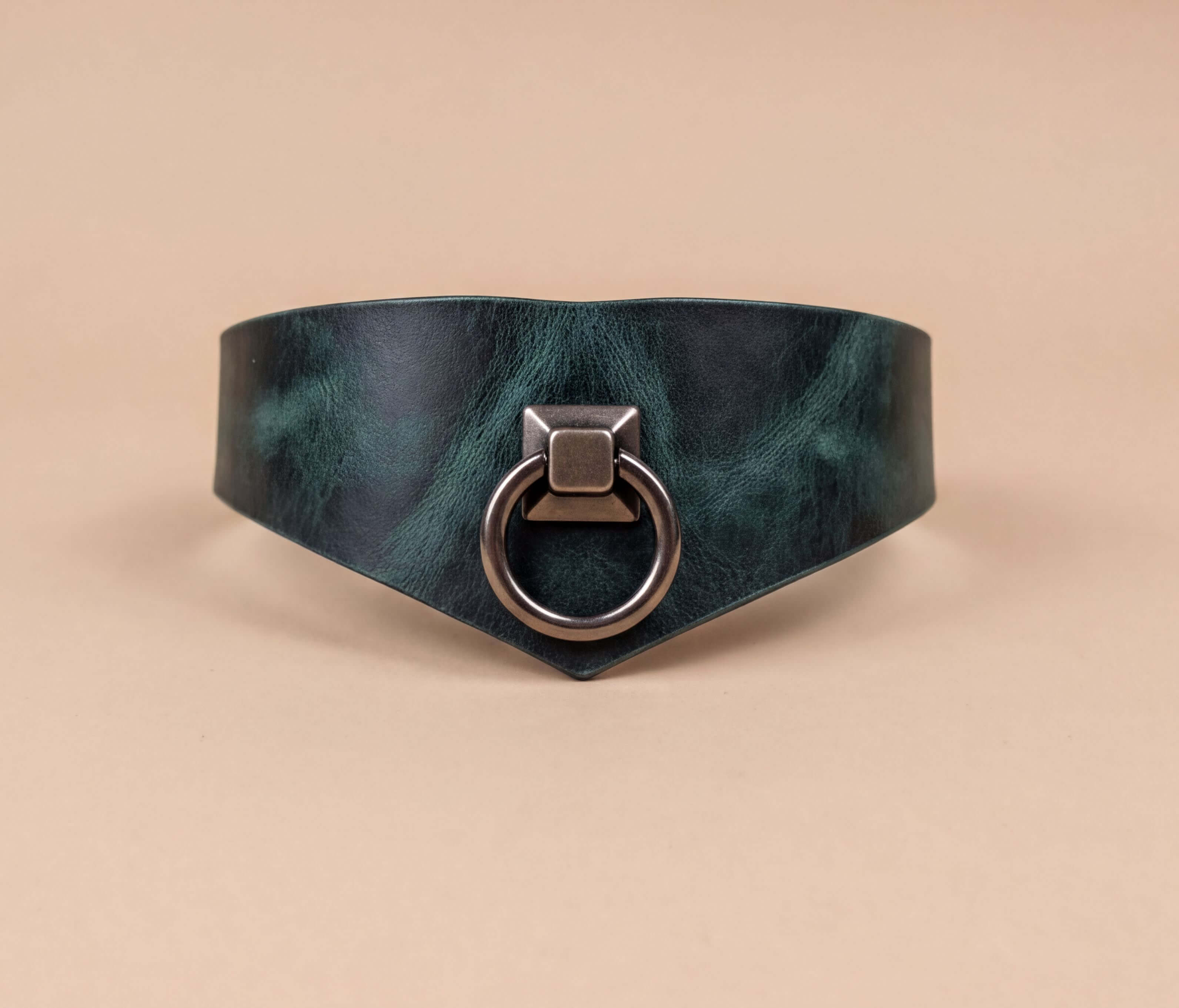 A dark green leather choker necklace with a metal ring and a square-shaped metal piece on the front.