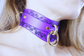 Purple Leather Floral Choker featuring delicate floral motifs and gold rings, showcasing elegance and intimacy.