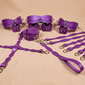 a collection of purple leather straps and buckles arranged on a beige background.