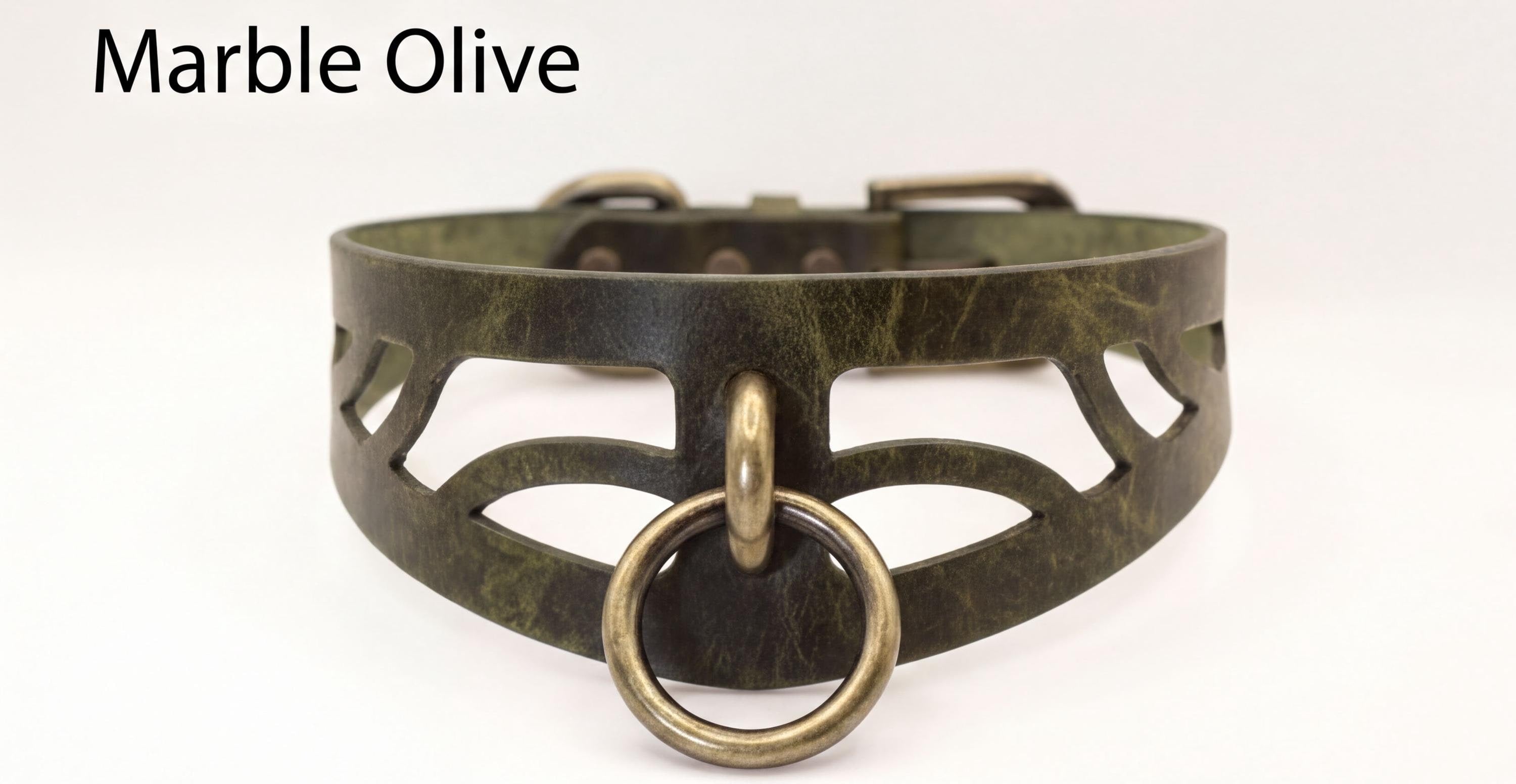 A close-up image of a green leather choker necklace with a metal ring and cutout design.