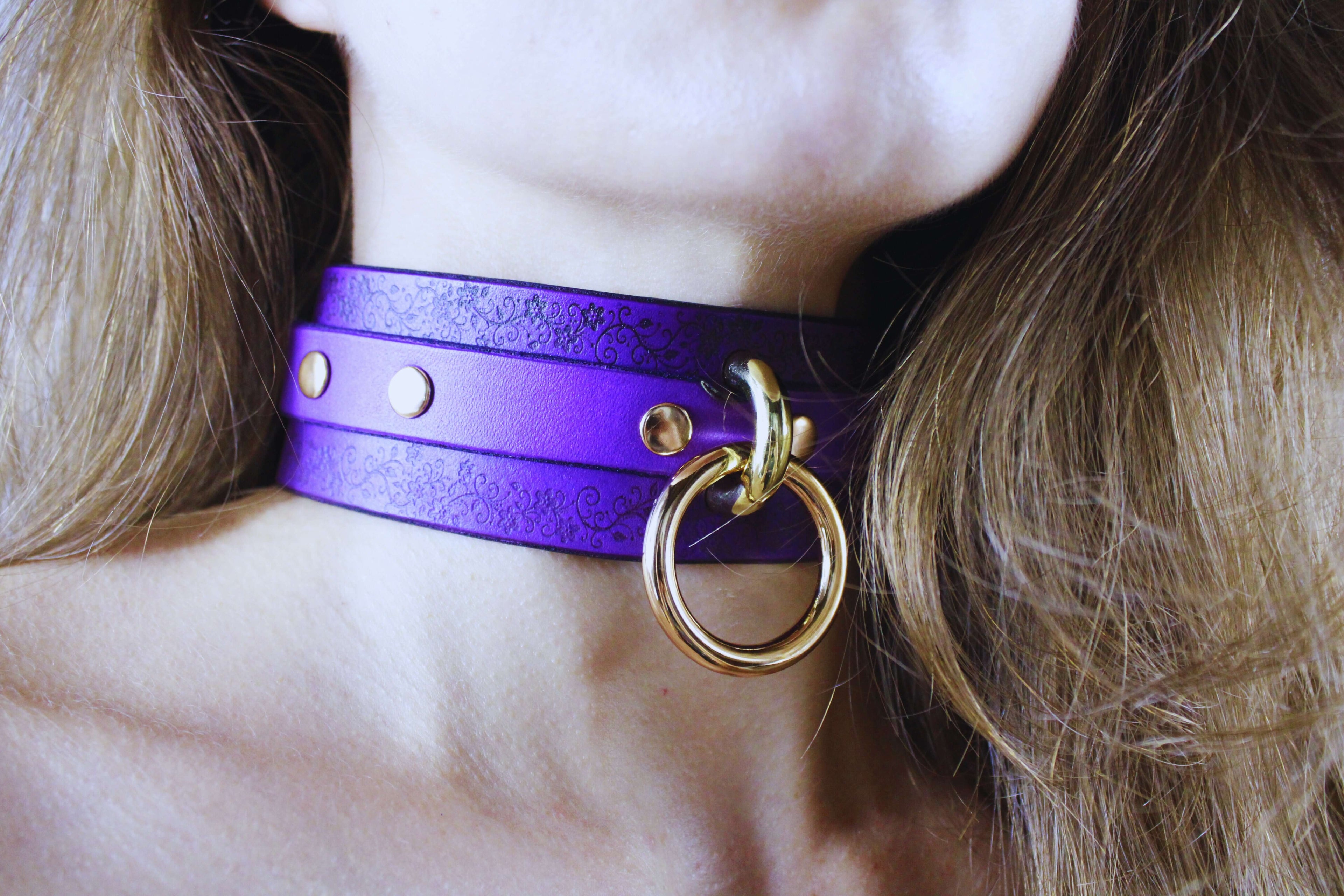 Floral Pattern Submissive Collar in purple leather with gold ring and studs, perfect for discreet day wear and personal expression.