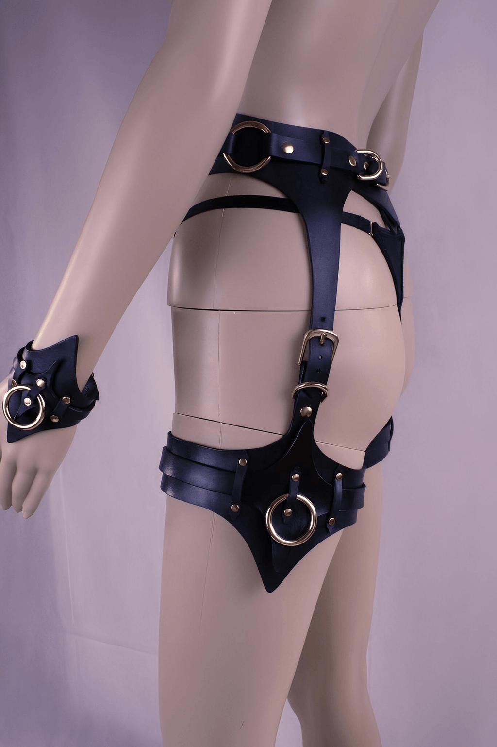 Leather thigh harness and cuffs set, perfect for BDSM play and bondage gear enthusiasts.