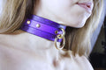 Floral Pattern Submissive Collar in purple leather worn as a discreet day choker with gold hardware.