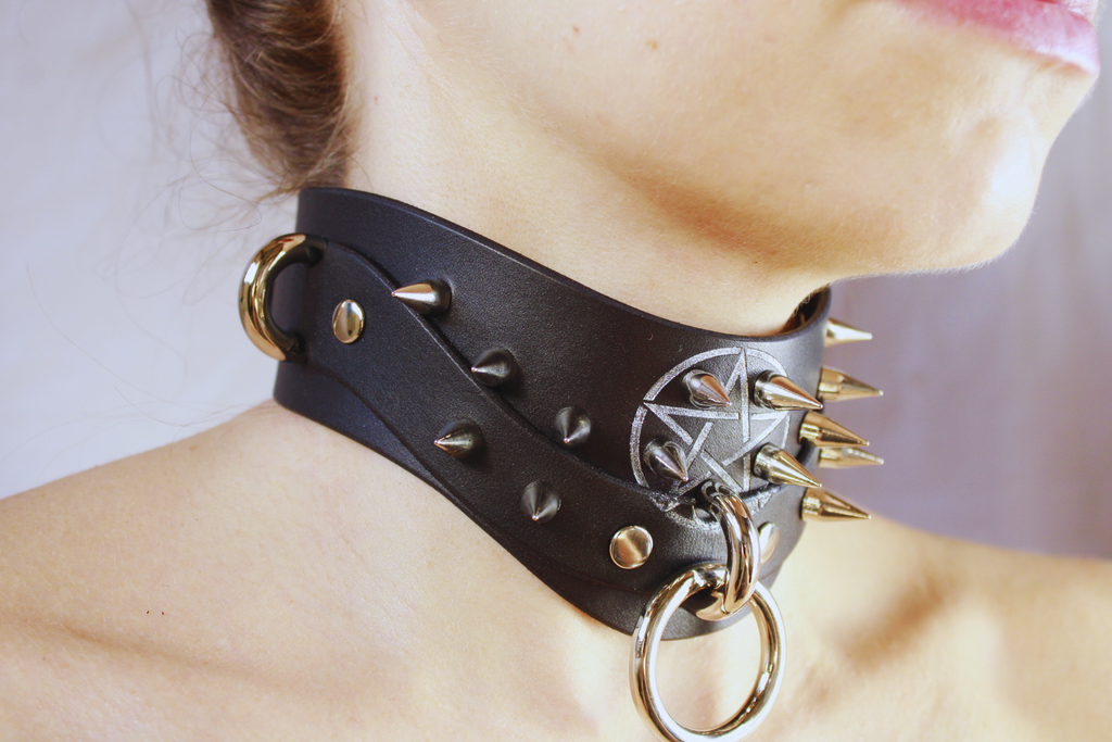 Pentagram BDSM Collar with spikes and o-rings, handcrafted black leather choker showcasing gothic design.