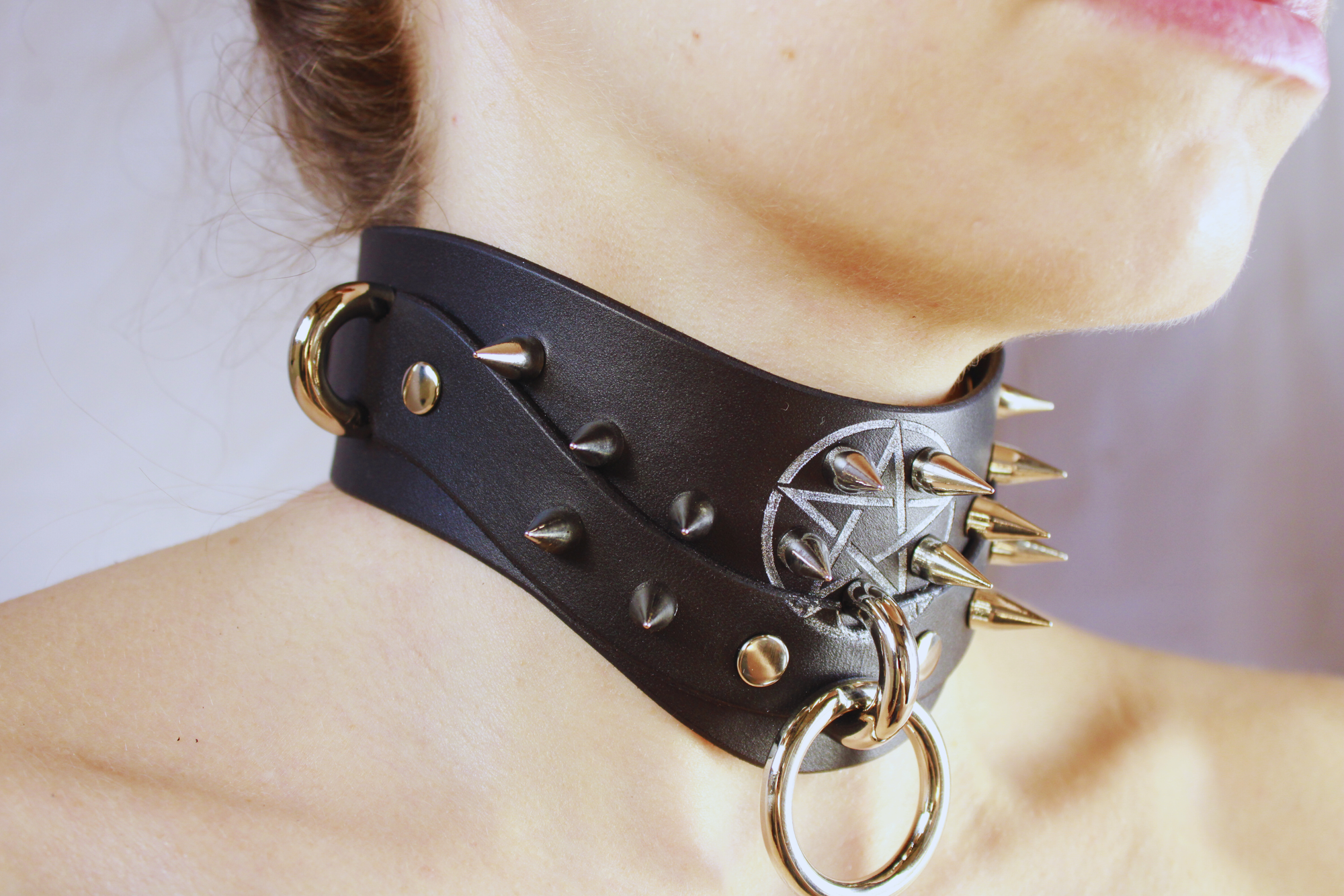 Pentagram BDSM Collar with spikes and o-rings, handcrafted black leather choker showcasing gothic design.