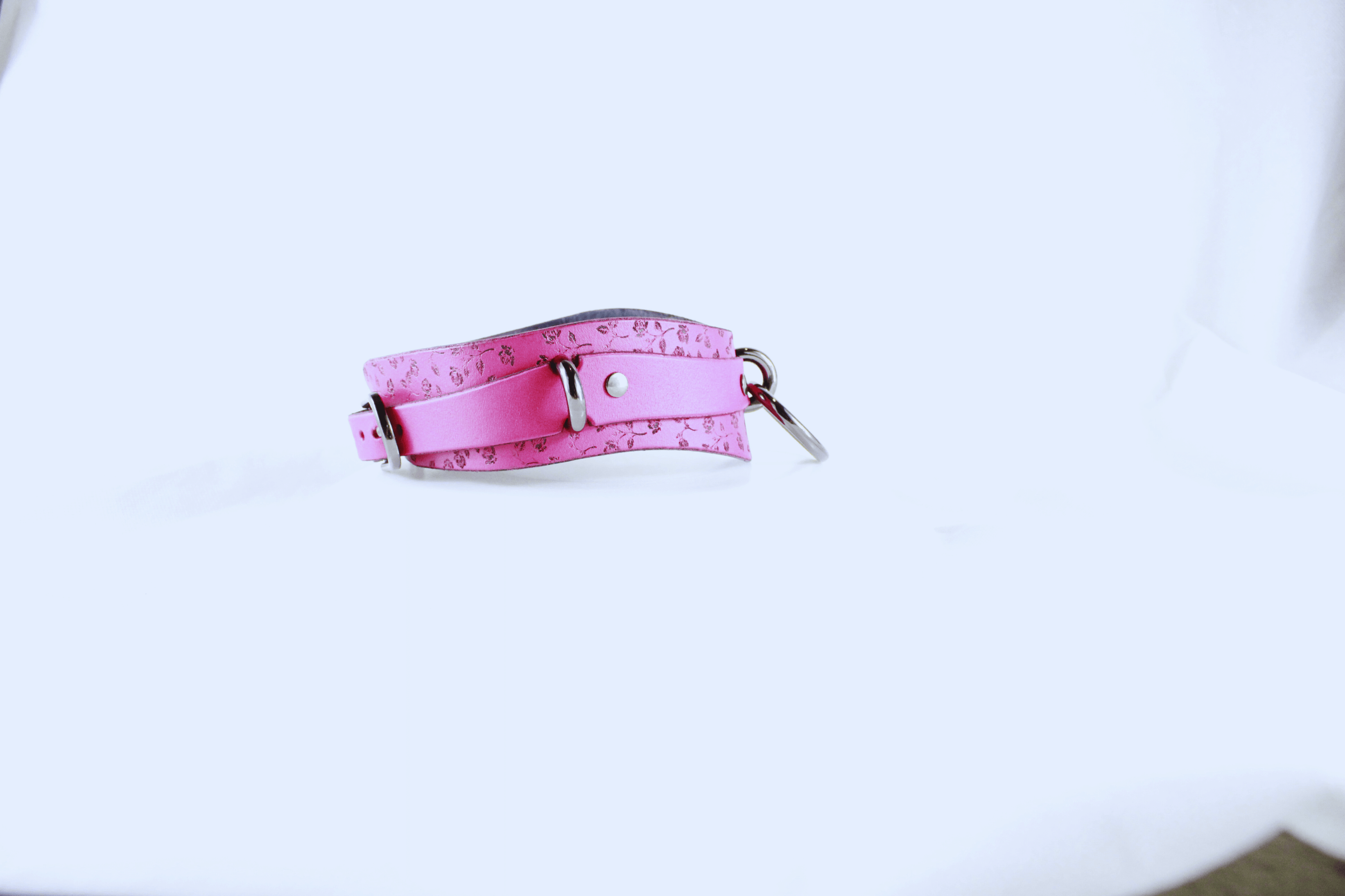 Rose Leather Submissive Collar in soft pink leather, designed for discreet day wear and elegance.