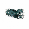 A green leather belt with silver spikes and a metal ring on it.