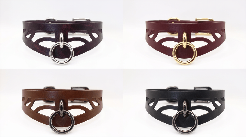 four different leather choker necklaces with metal rings, each in a distinct color and design.