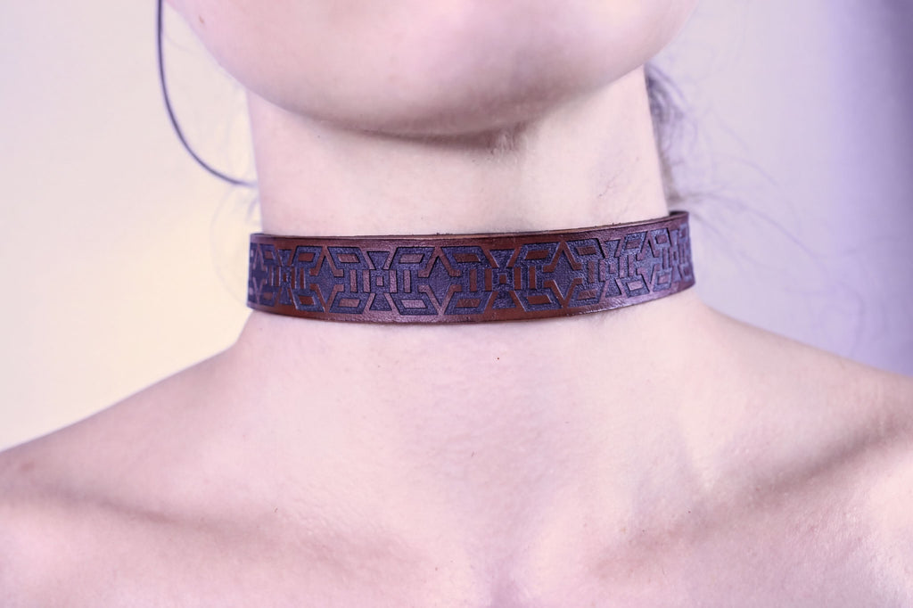 Handmade minimalist BDSM collar featuring a tribal geometric motif, perfect for submissive jewelry and discreet day wear.