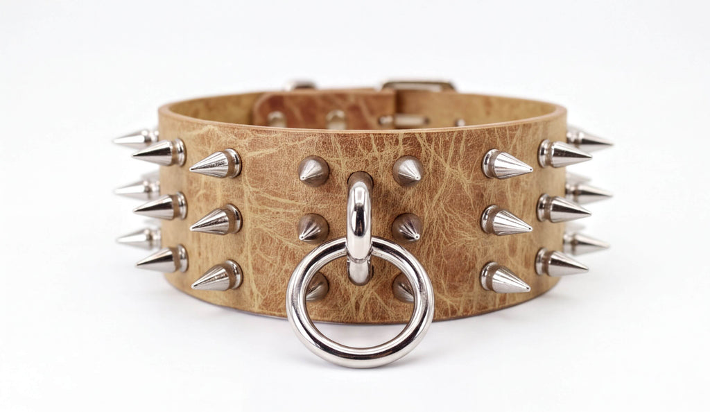 A leather choker necklace with metal spikes protruding from it.