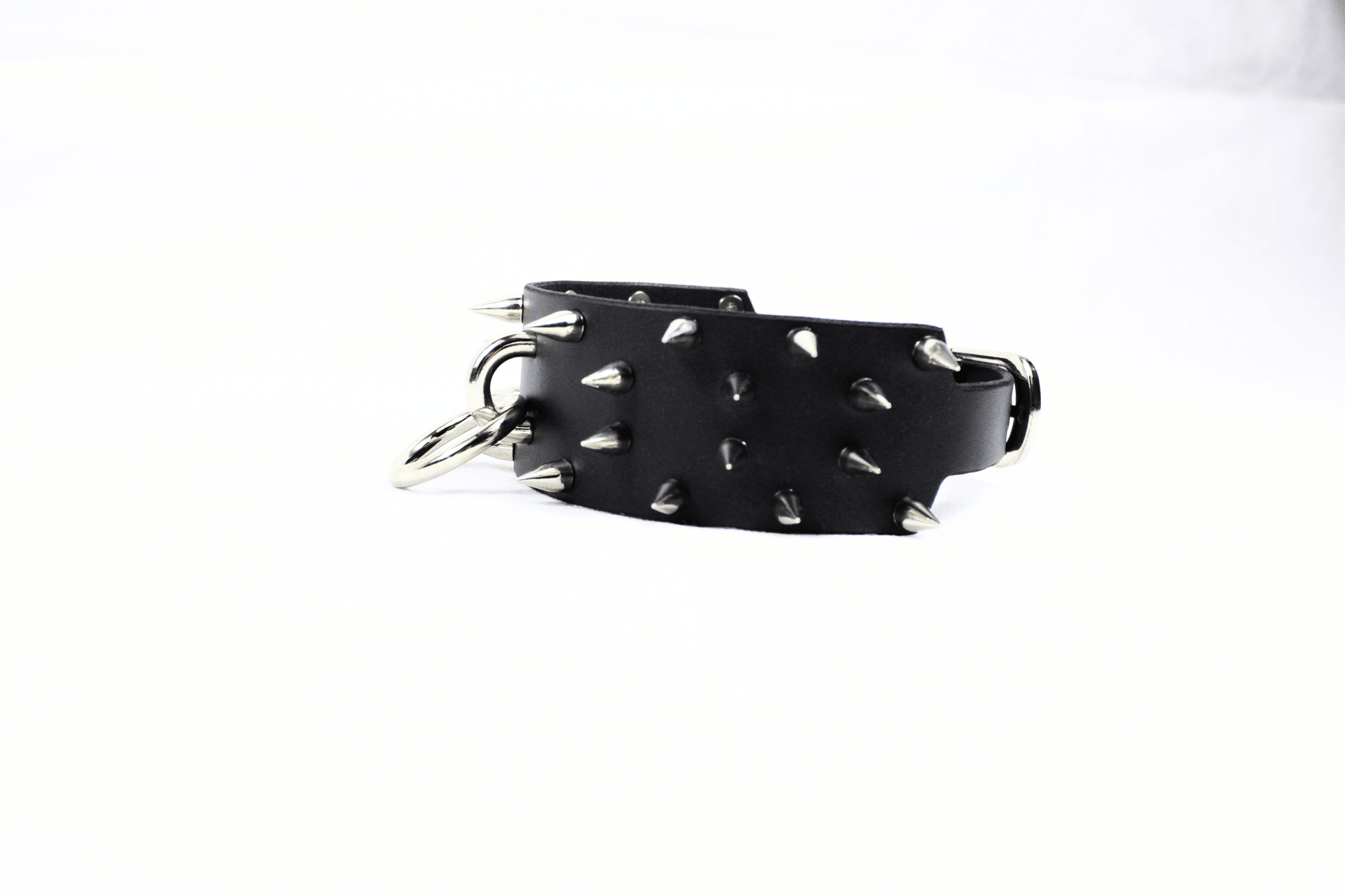 Rogue BDSM Collar – Spiked Posture Choker for Submissive & Dom Play showcasing its thick leather and steel spikes.