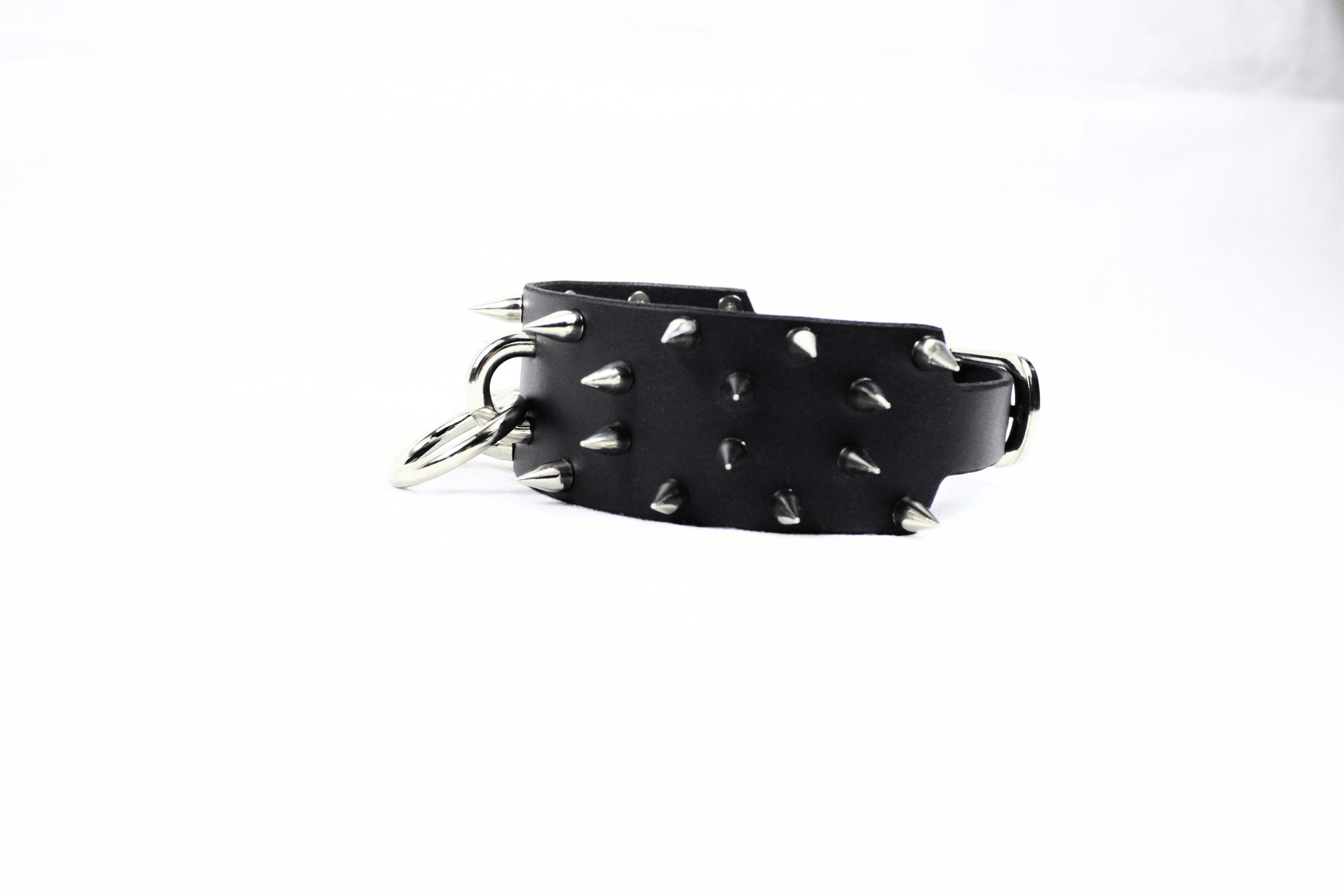 Rogue BDSM Collar – Spiked Posture Choker for Submissive & Dom Play showcasing its thick leather and steel spikes.