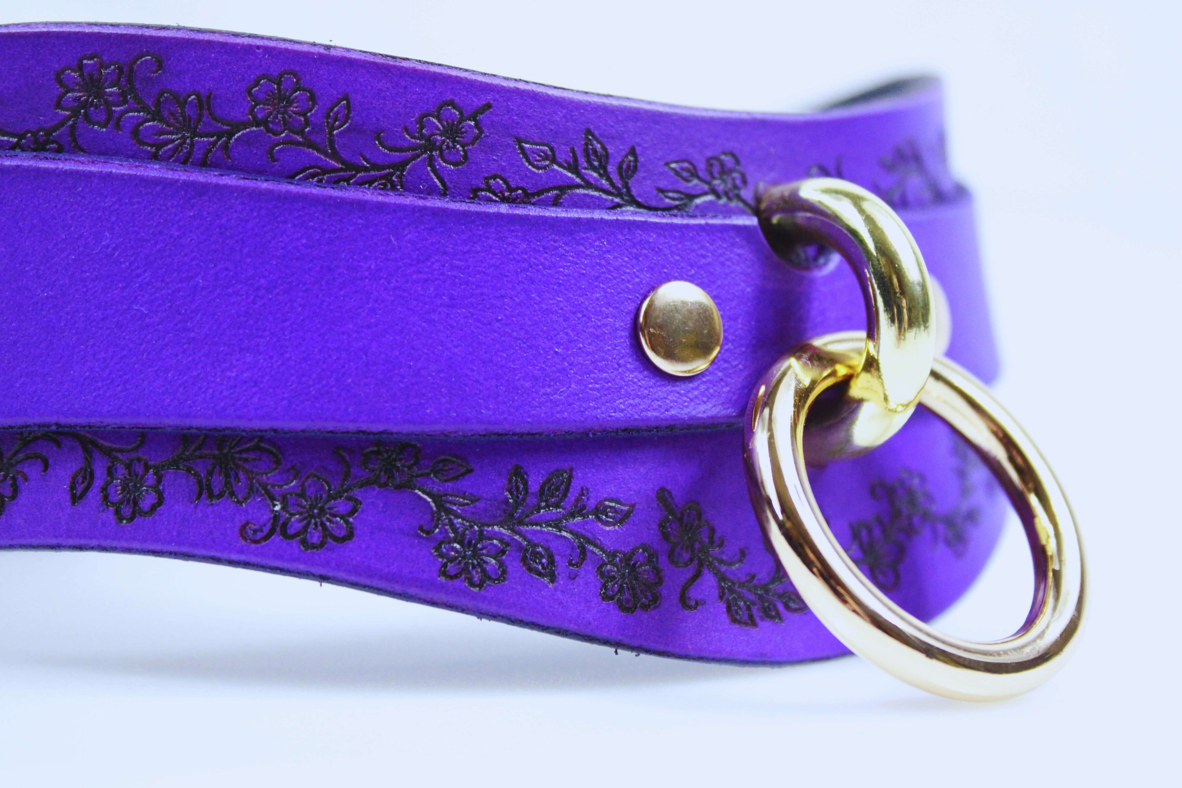 Purple Leather Floral Choker – Elegant choker with floral design and gold rings, perfect for stylish accessories.