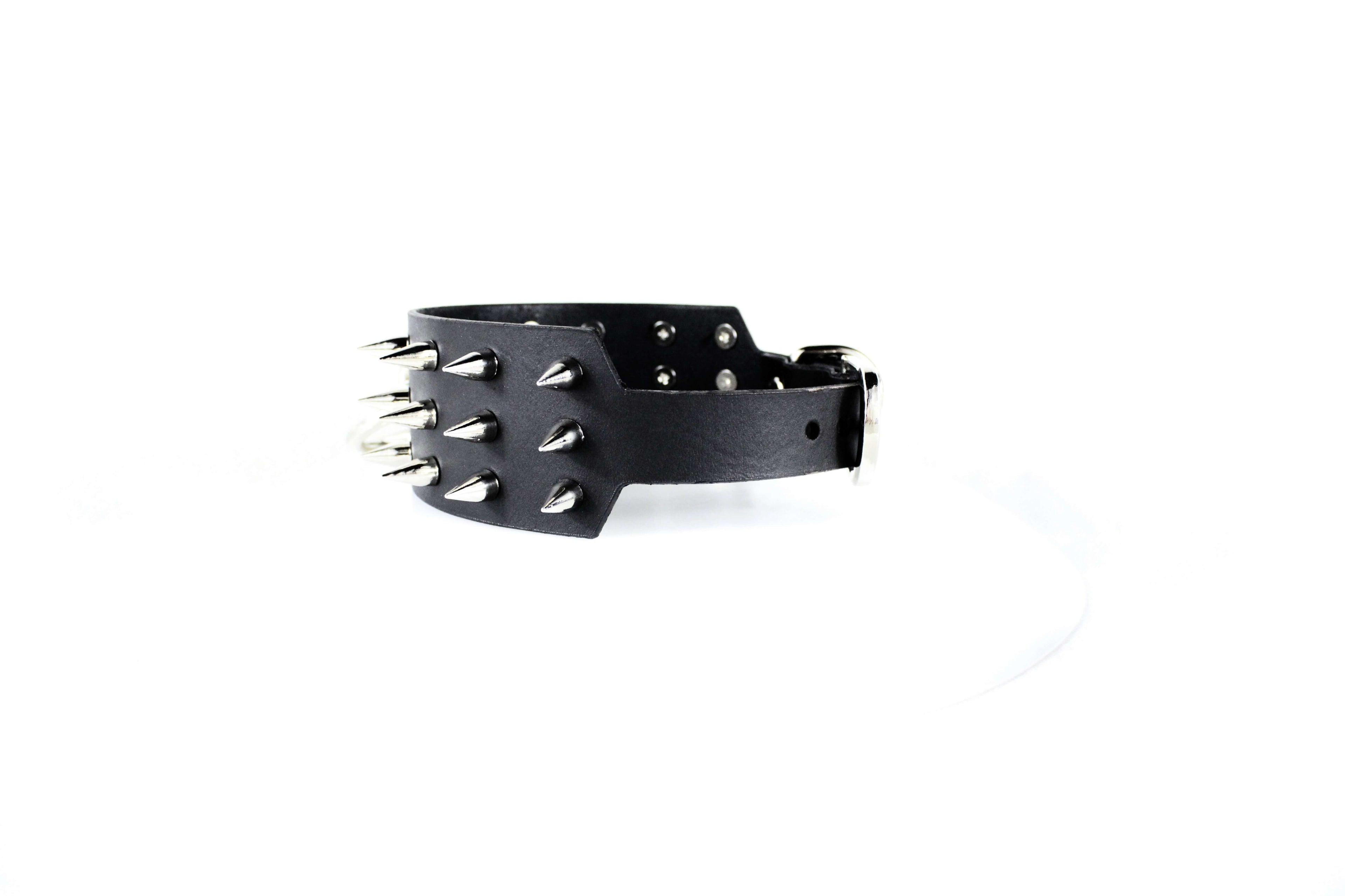 Black Spiked BDSM Collar – Leather Submissive Collar with O-Ring featuring polished metal spikes.