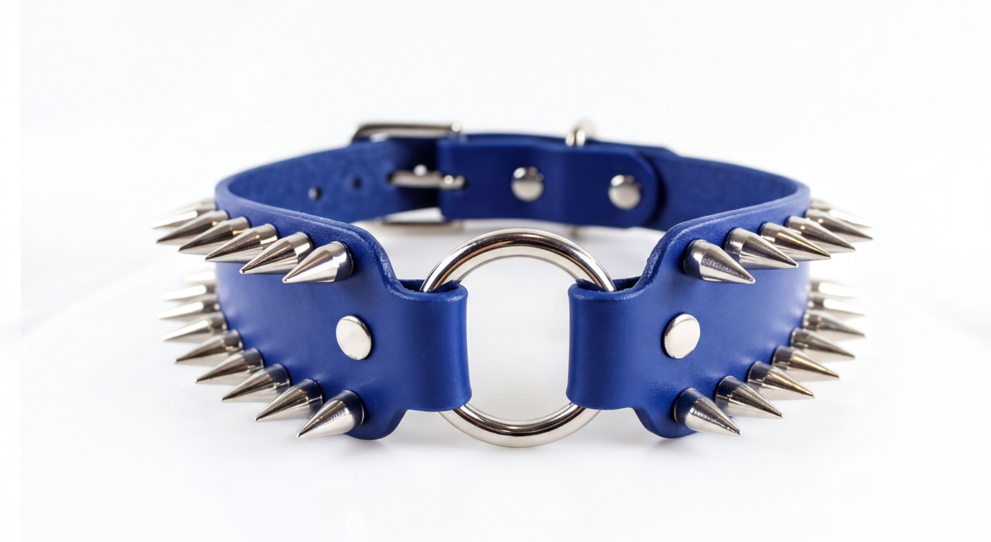 A blue leather collar with spikes protruding from it, featuring a metal ring in the center.
