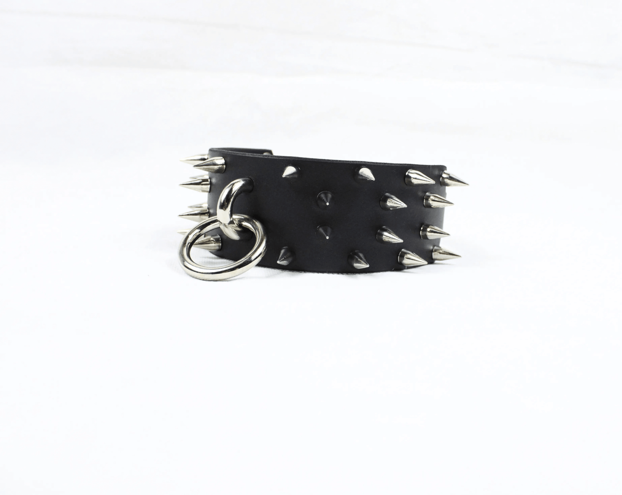 Rogue BDSM Collar – Spiked leather posture choker with steel spikes and metal rings for dominance and elegance.