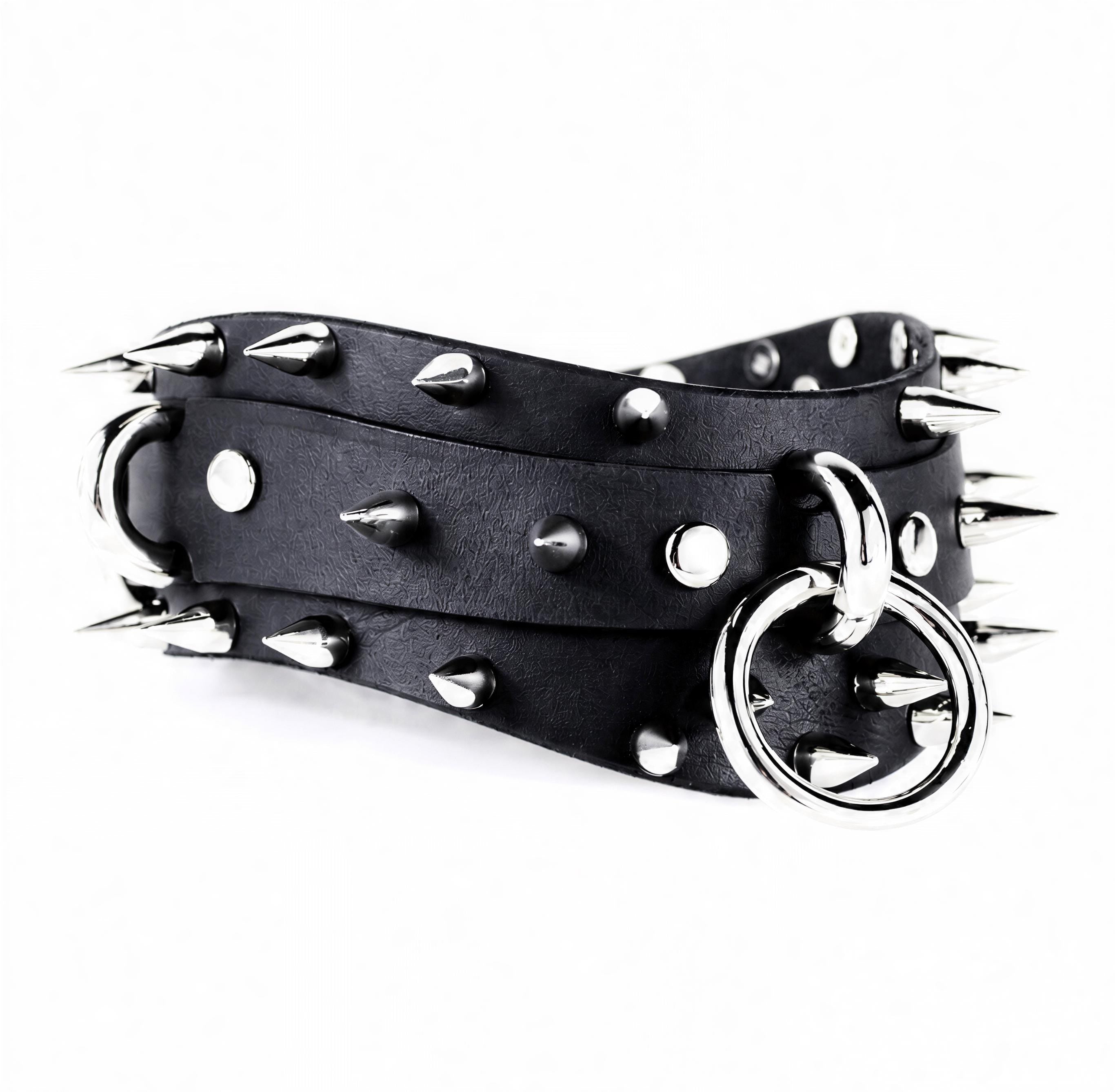 A black leather belt with silver spikes and a metal ring on it.