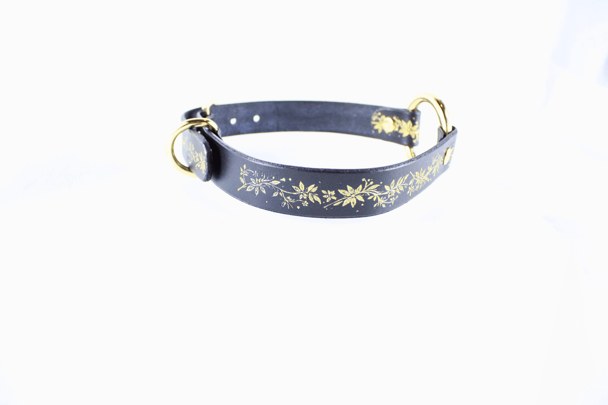 Black Leather Fetish Collar with golden floral pattern and polished O-ring for bondage or stylish wear.