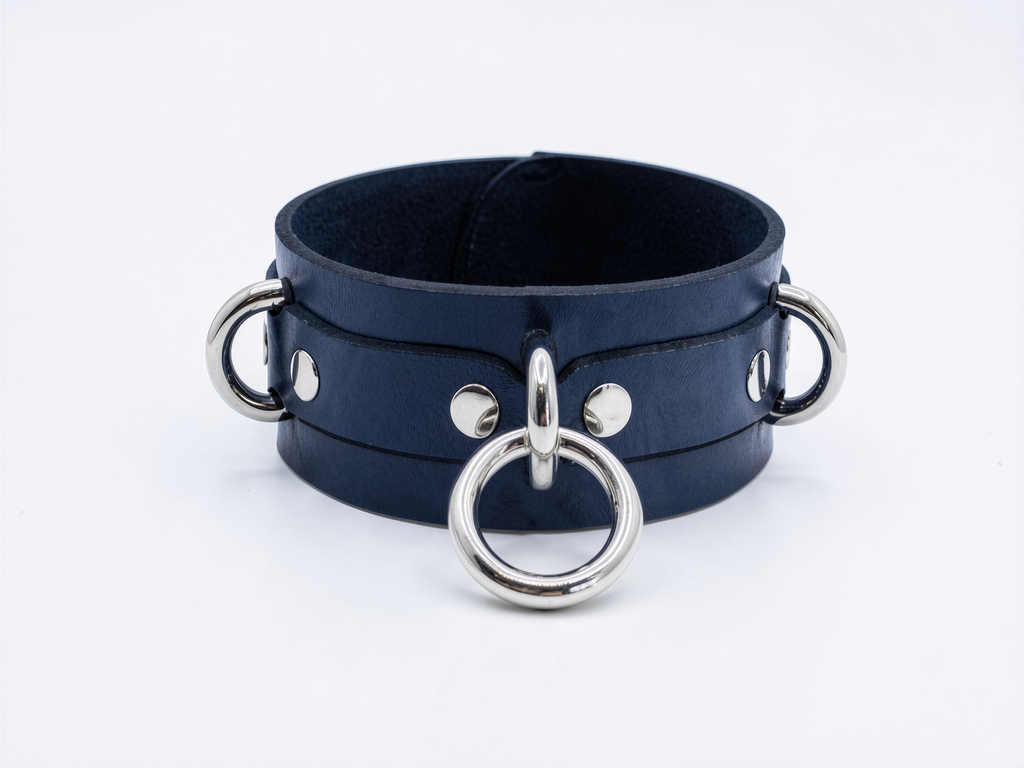 A dark blue leather choker necklace with silver metal rings and buckles.
