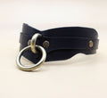 A black leather choker necklace with a metal ring and two metal buttons.