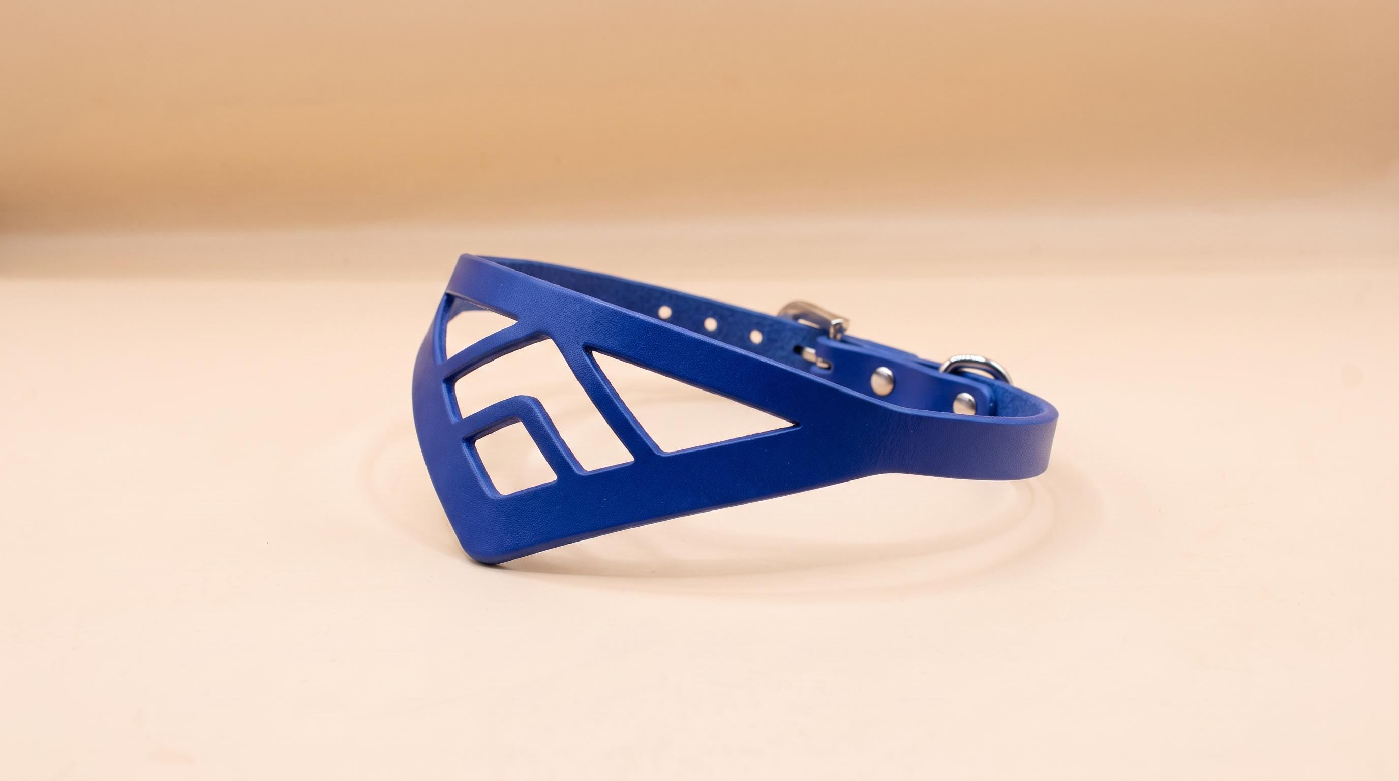 A blue, geometric-shaped collar or strap is shown against a light background.