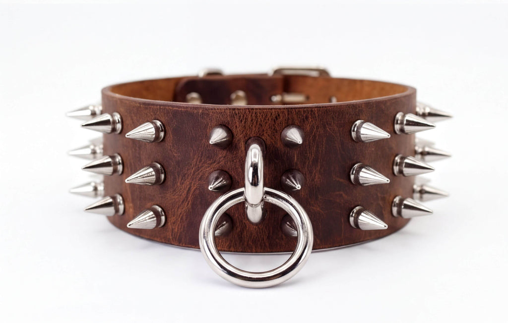 A brown leather choker necklace with silver spikes protruding from it.