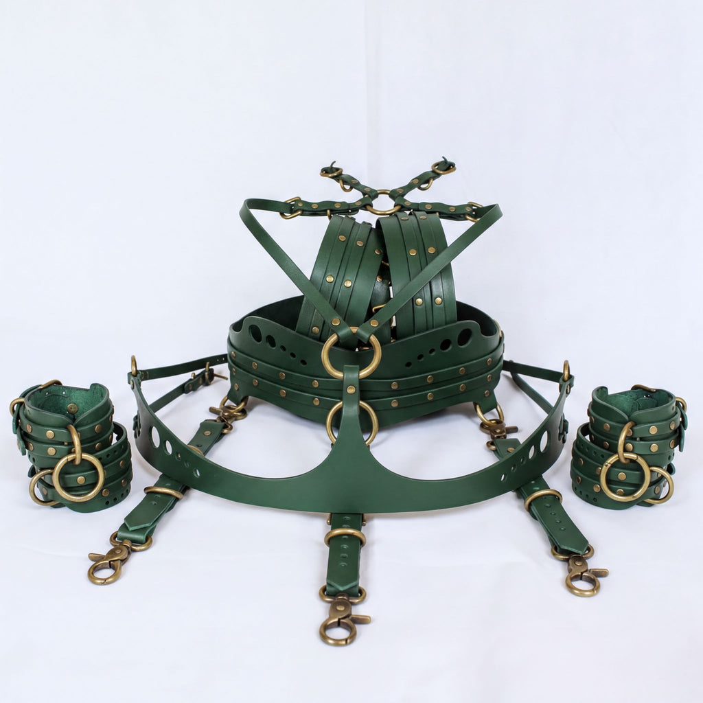 A set of green leather straps and buckles, likely used for BDSM or BDSM-related activities.
