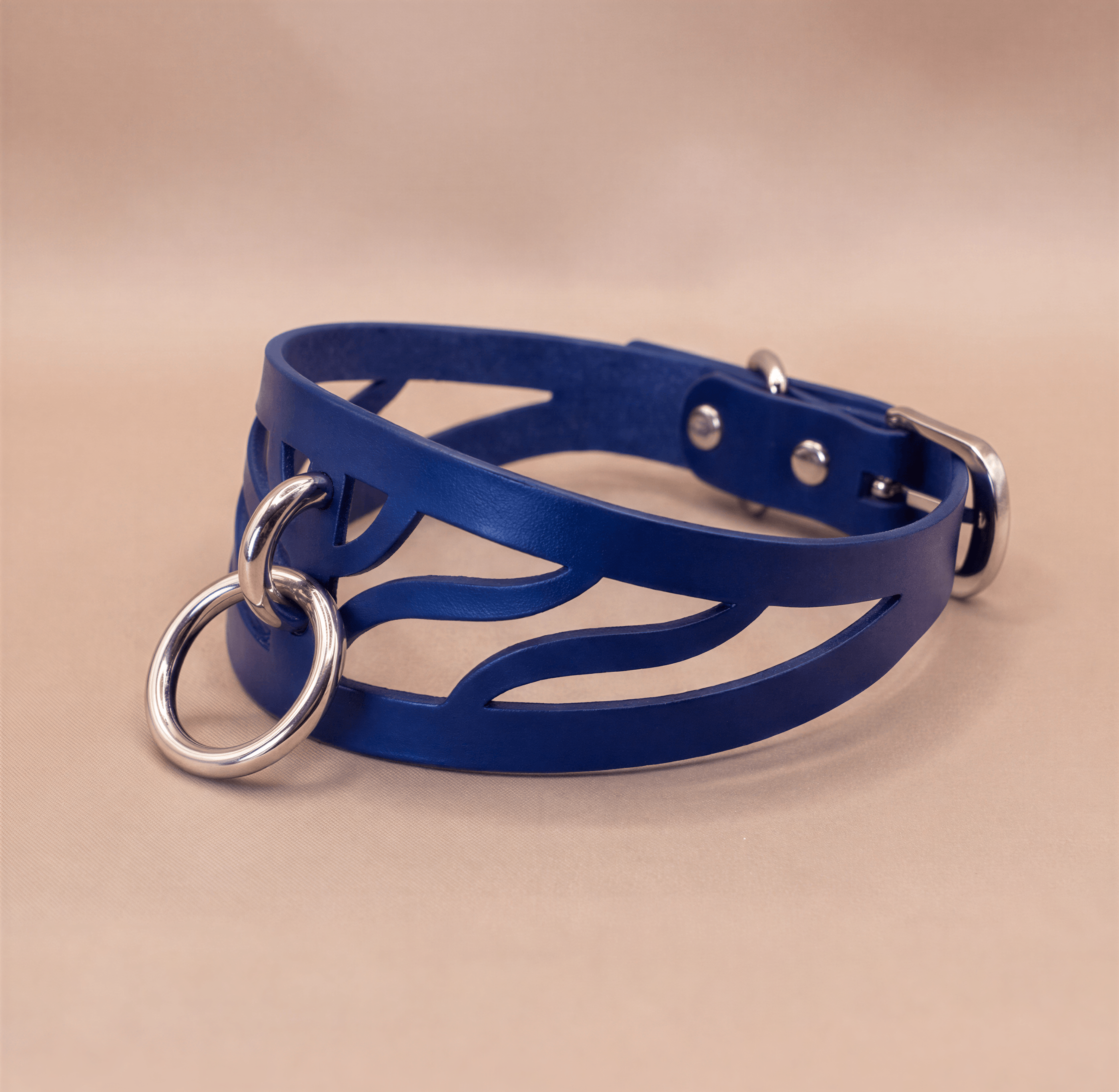 A blue leather choker necklace with metal rings and a metal buckle.
