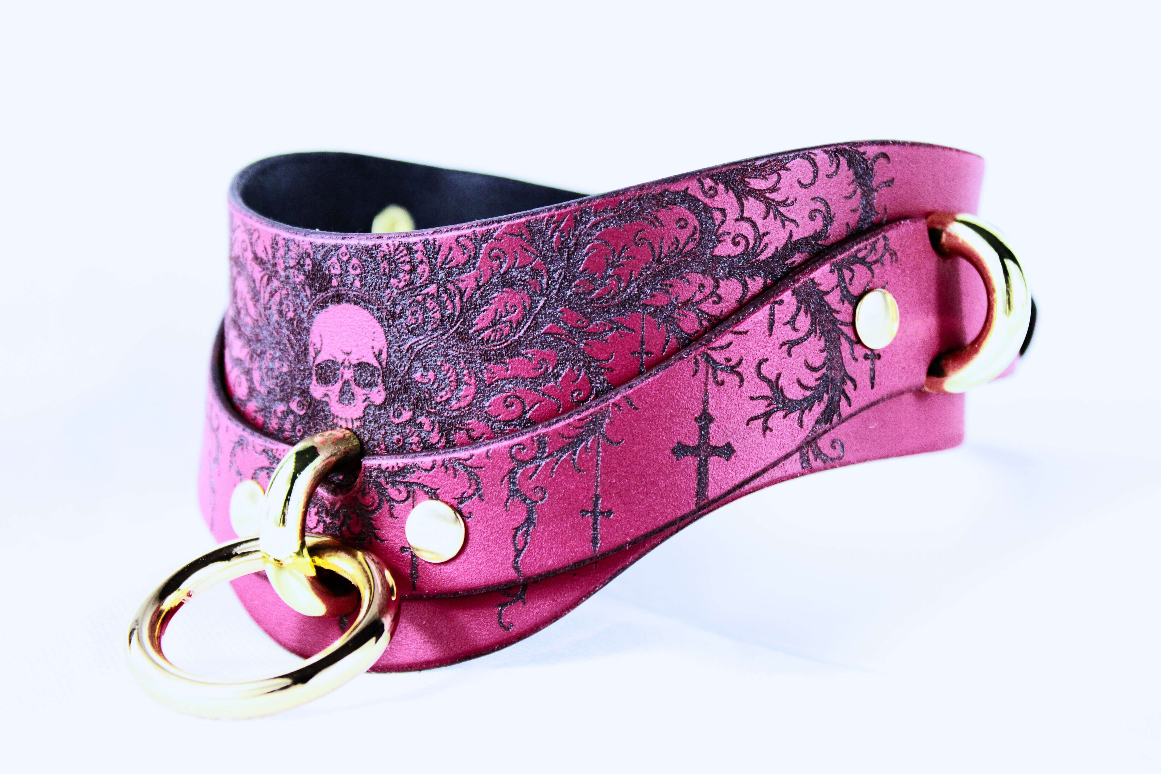 Gothic Skull Posture Collar showcasing intricate designs on deep crimson leather with metallic accents.