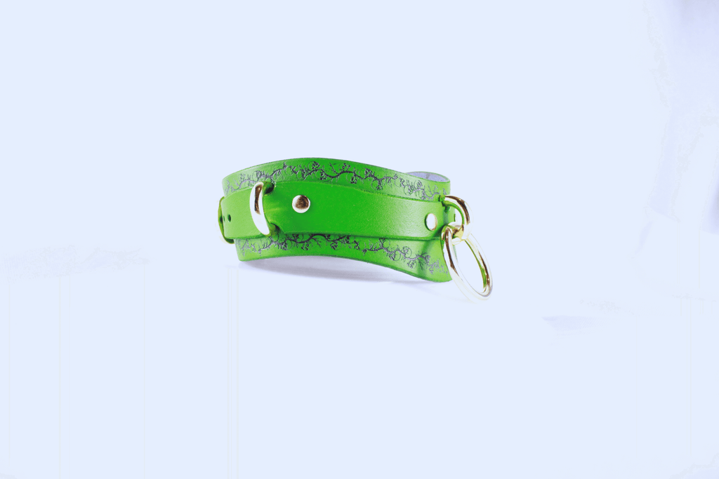 Skull Leather Choker with floral skull motif in vibrant green leather, showcasing elegance and rebellion.