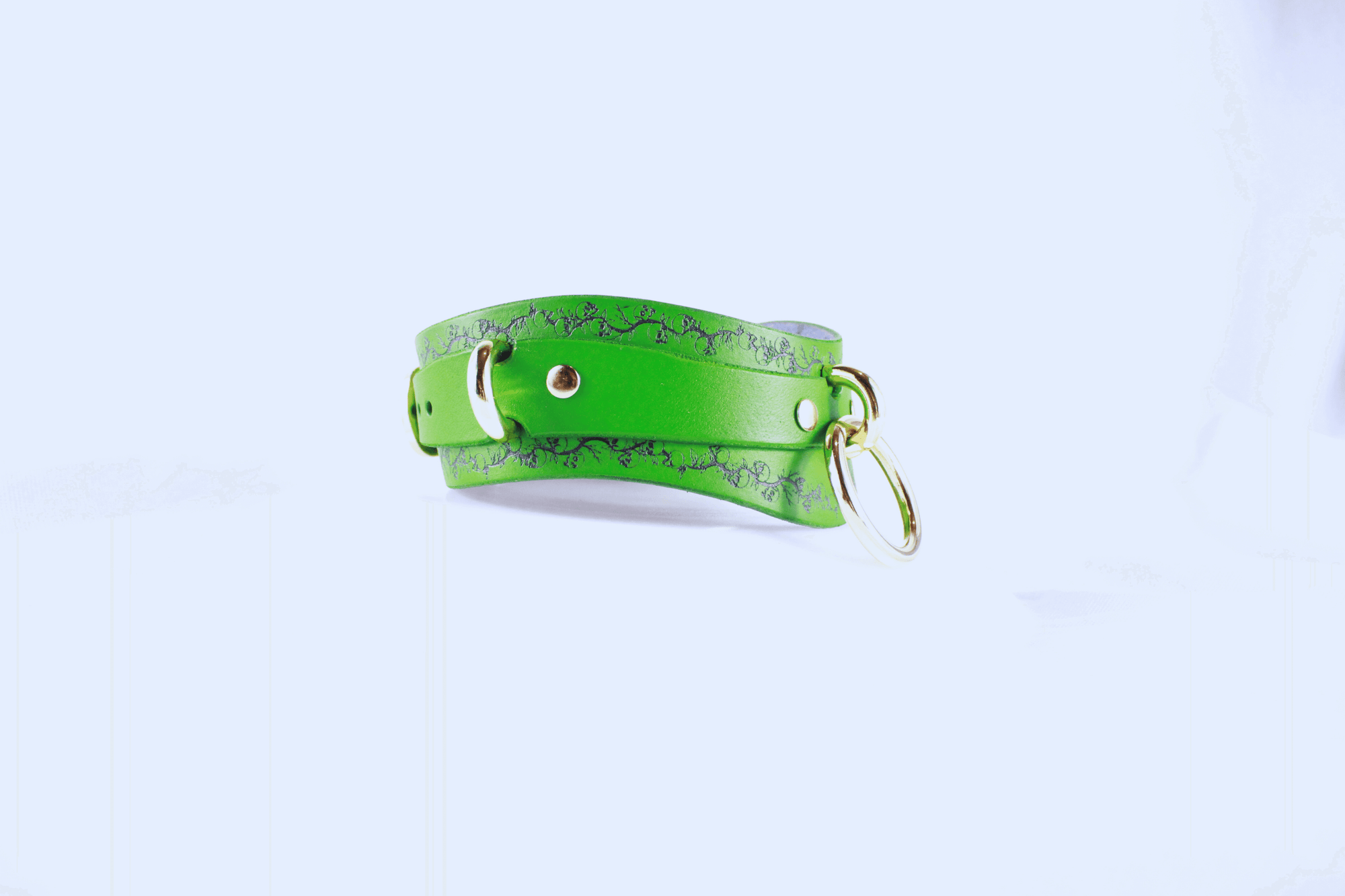 Skull Leather Choker with floral skull motif in vibrant green leather, showcasing elegance and rebellion.