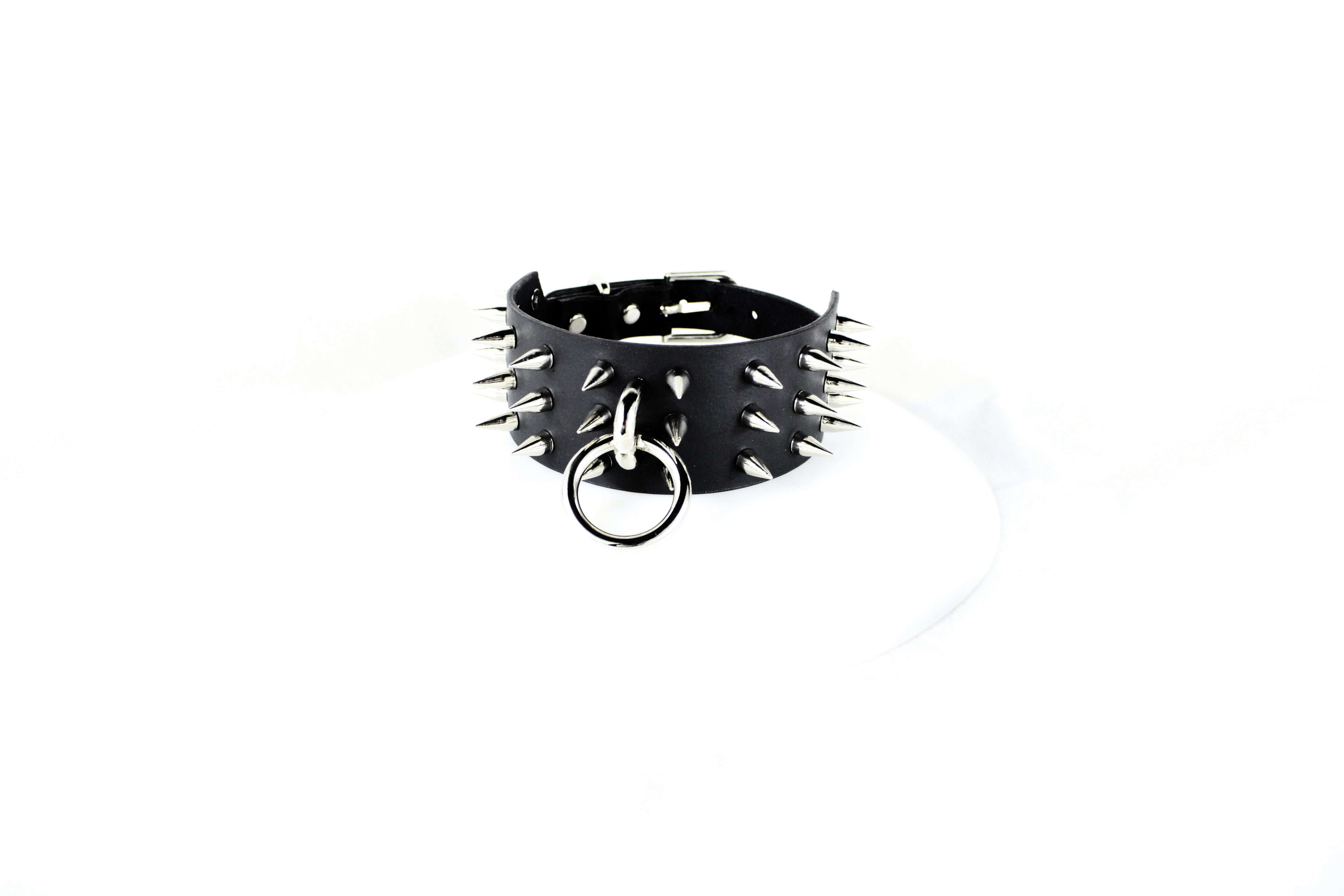 Black Spiked BDSM Collar – Handmade leather collar with spikes and O-ring for submissive wear.
