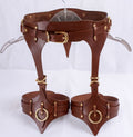 A pair of brown leather straps with gold hardware, designed to be worn as a corset or waist corset.