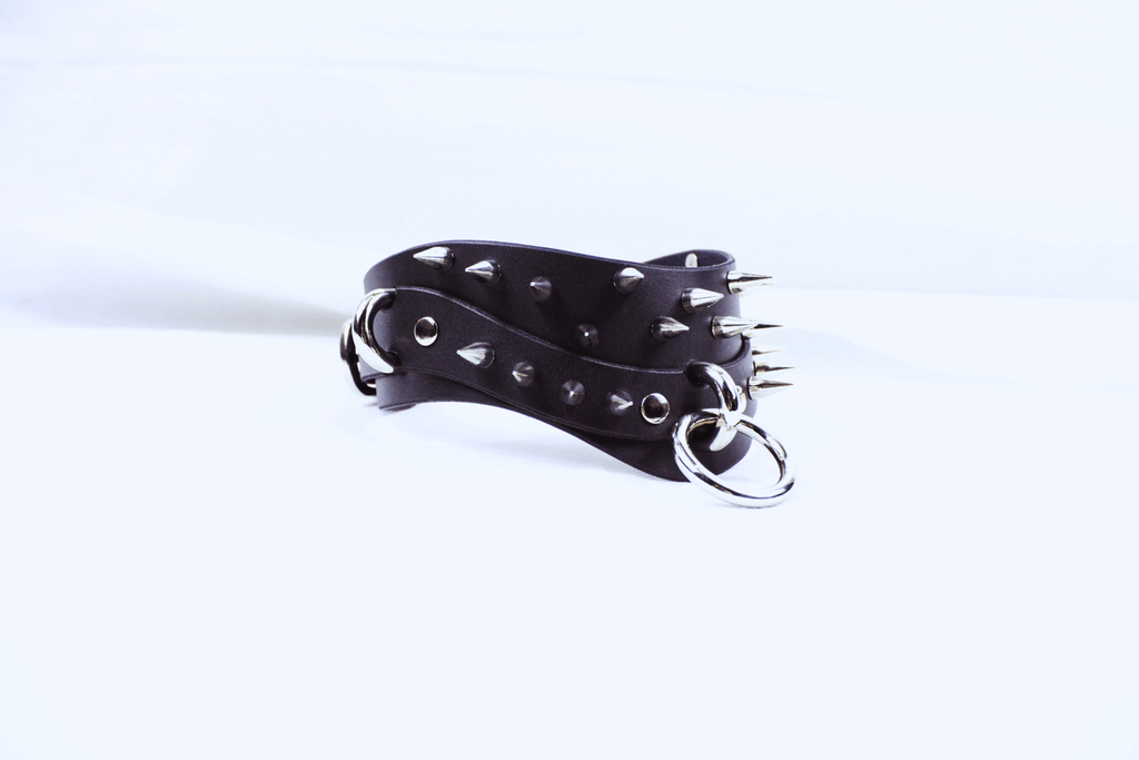 Black Spiked BDSM Collar showcasing spikes and rings, perfect for gothic fashion and submissive style.