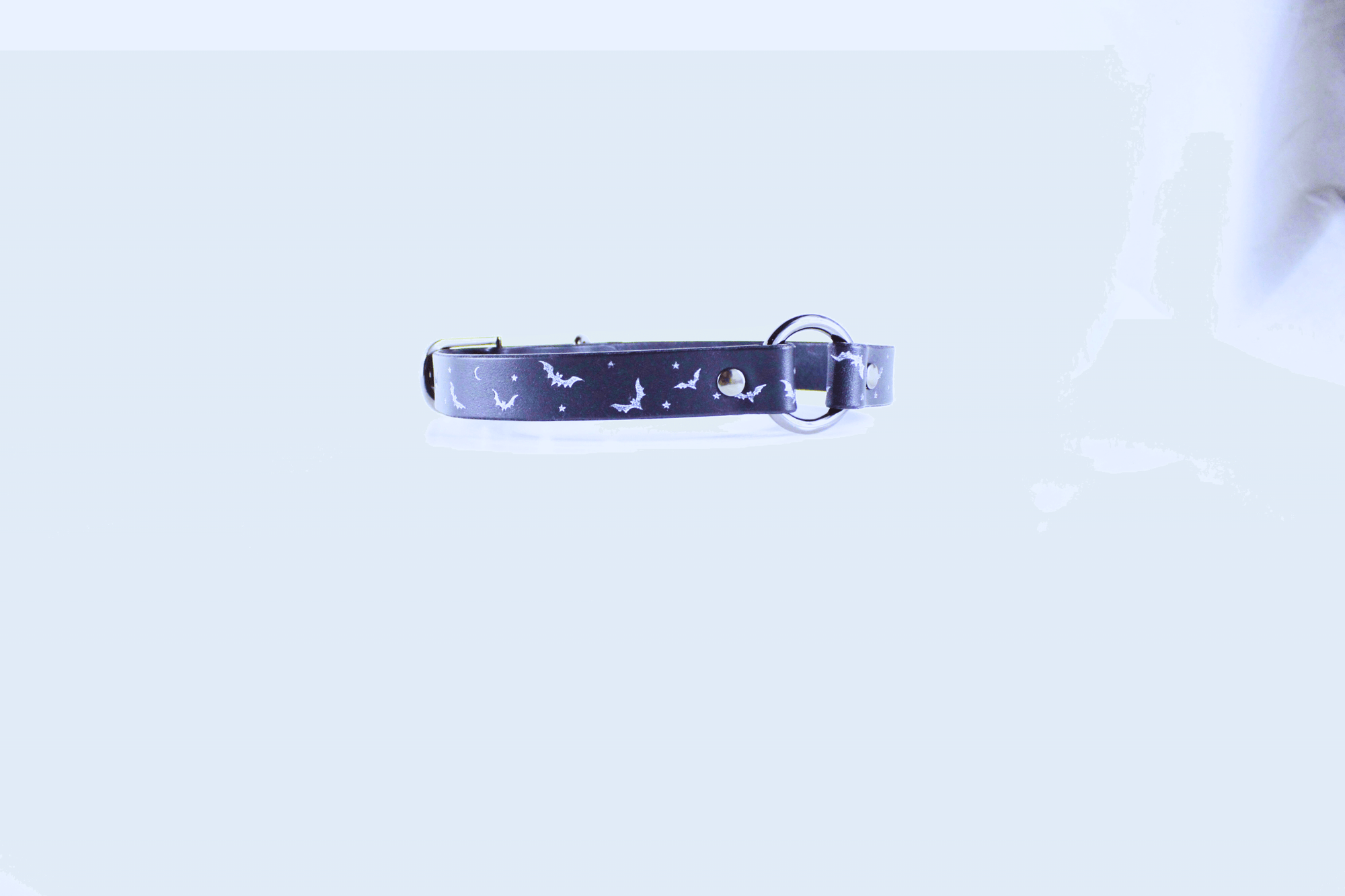 Bat and Moon Leather Choker featuring bats and crescent moons on a dark leather band.