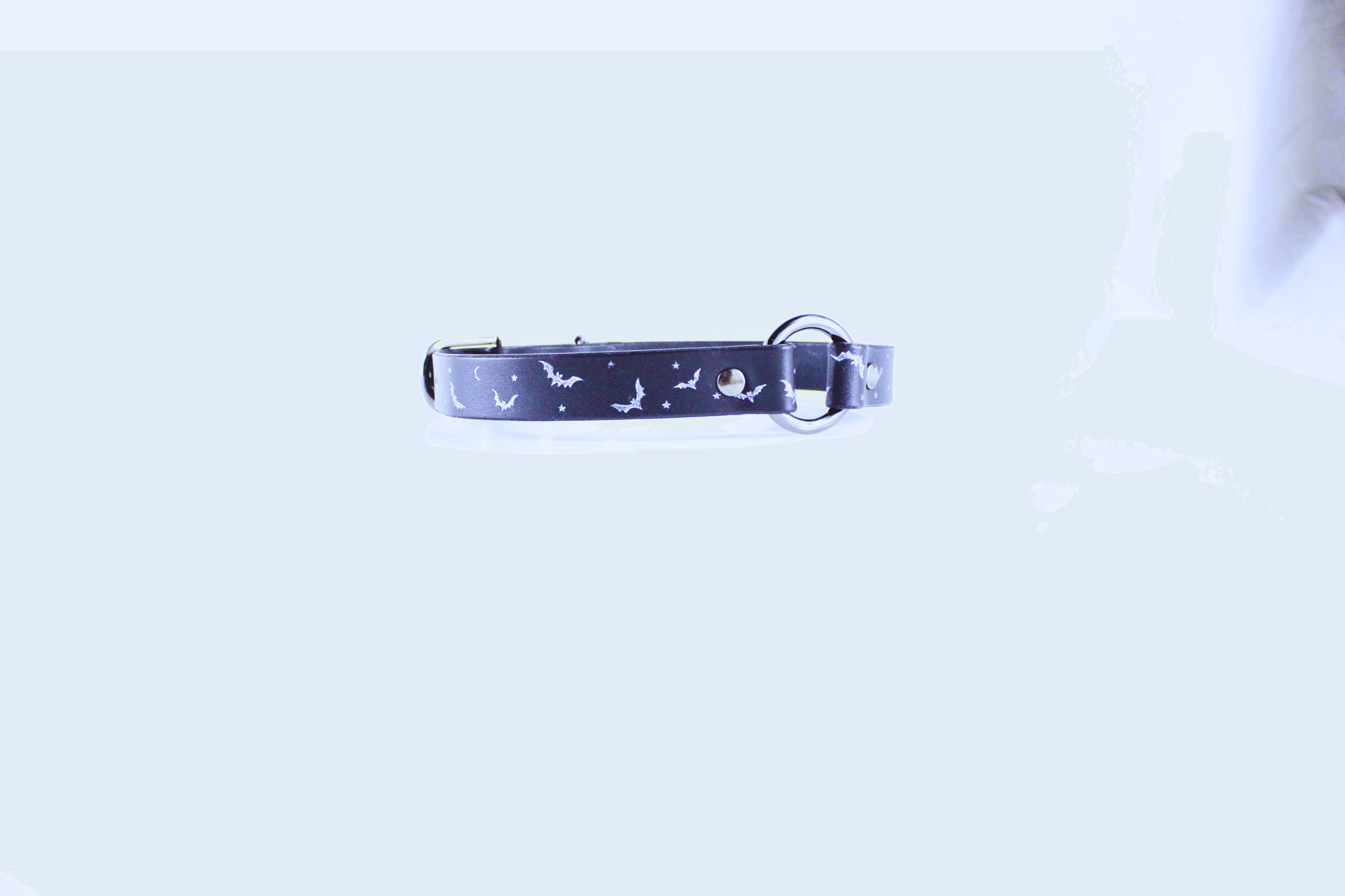 Bat and Moon Leather Choker featuring bats and crescent moons on a dark leather band.