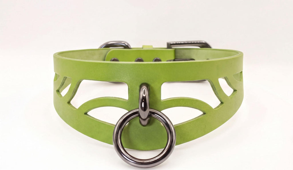 A green leather choker necklace with a metal ring and a metal clasp.