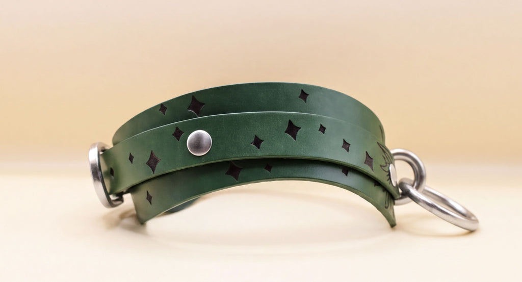 A green leather choker necklace with a silver metal clasp and a star-shaped embellishment on the front.