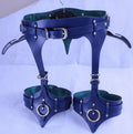 A pair of blue leather corsets with metal hardware, including buckles and rings, displayed on a white background.