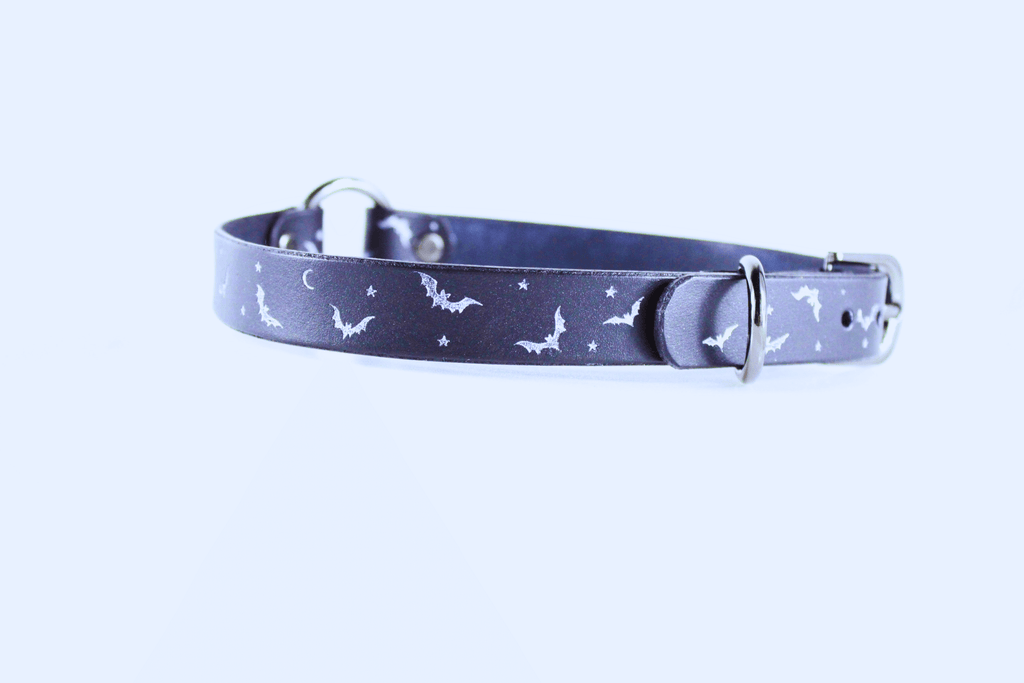Bat and Moon Leather Choker featuring bats, crescent moons, and stars on a sleek leather band.