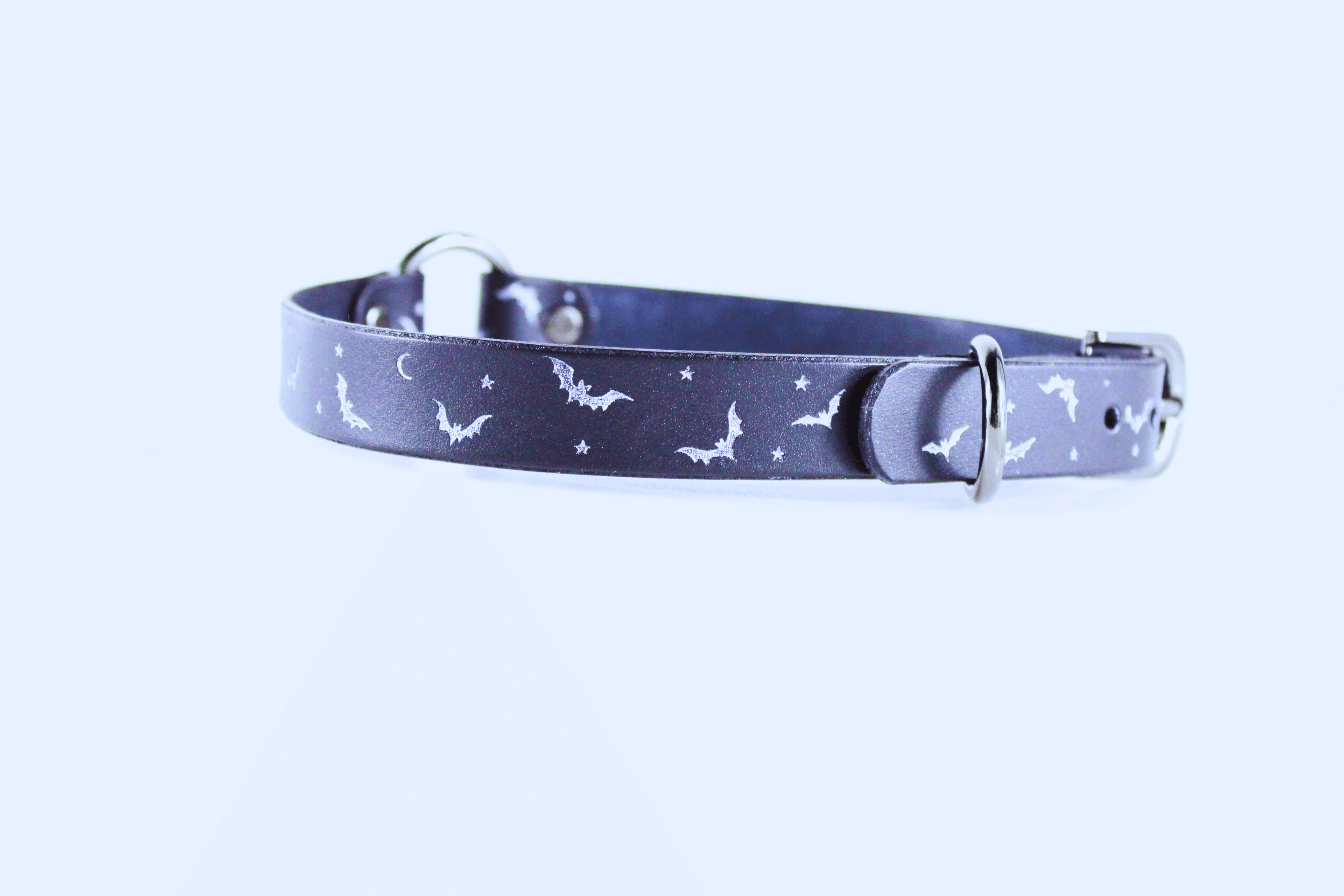 Bat and Moon Leather Choker featuring bats, crescent moons, and stars on a sleek leather band.