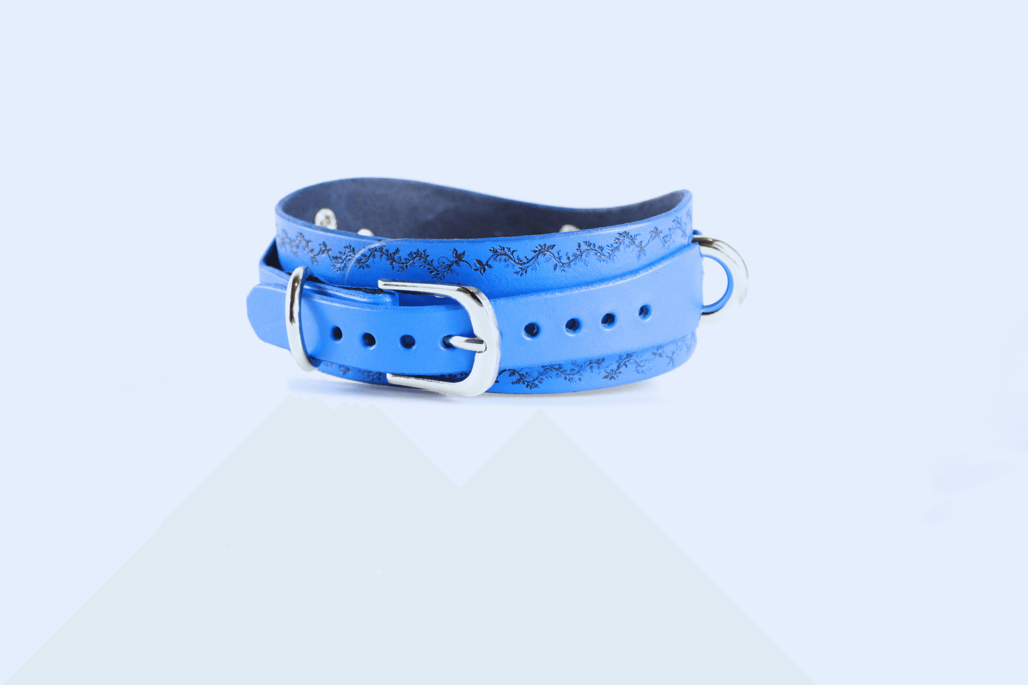 Floral Vine Posture Collar in blue leather featuring polished hardware and a delicate floral vine design.