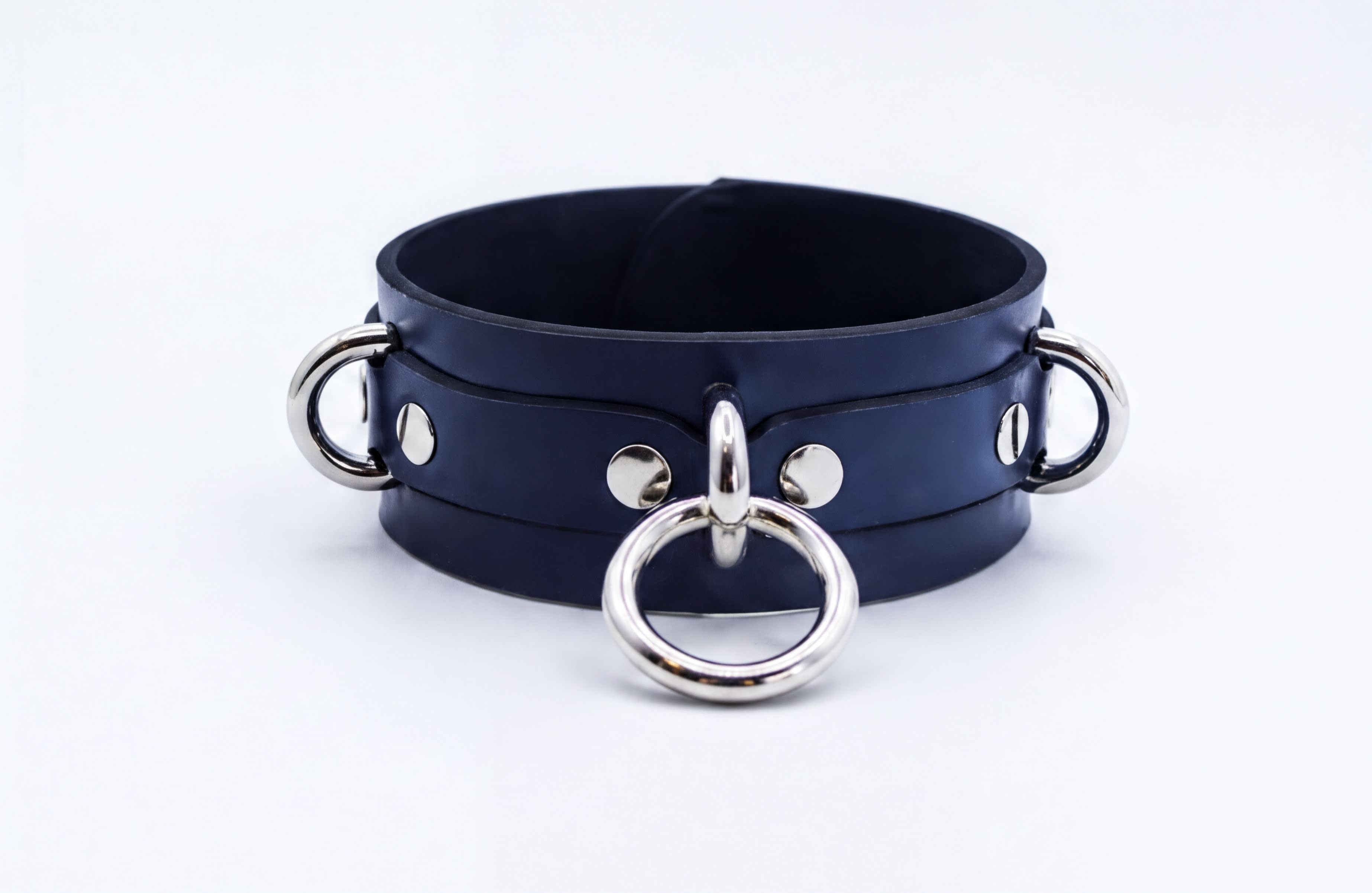 A dark blue leather choker necklace with silver metal rings and buckles.