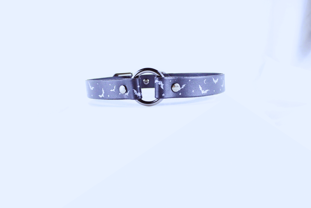 Bat and Moon Leather Choker showcasing bats and crescent moons on a dark leather band.