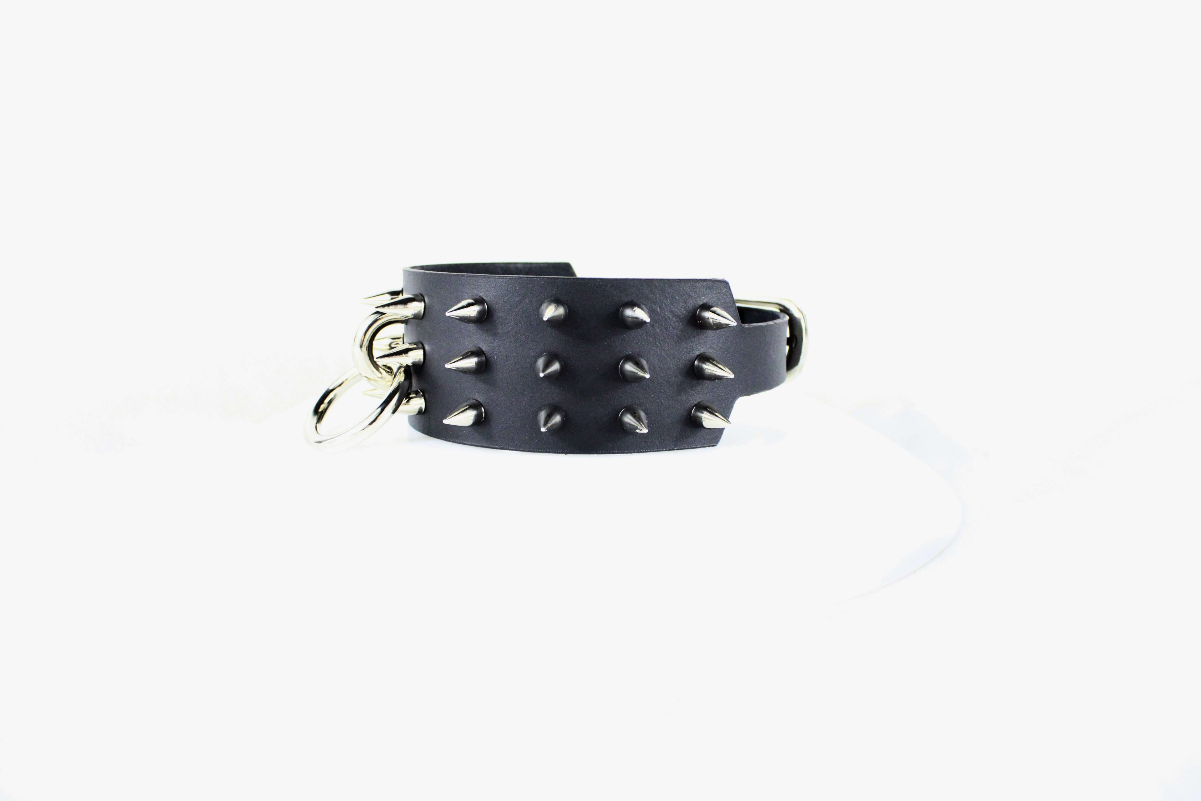 Black Spiked BDSM Collar featuring metal spikes and O-ring, crafted from premium leather, embodying gothic rebellion.